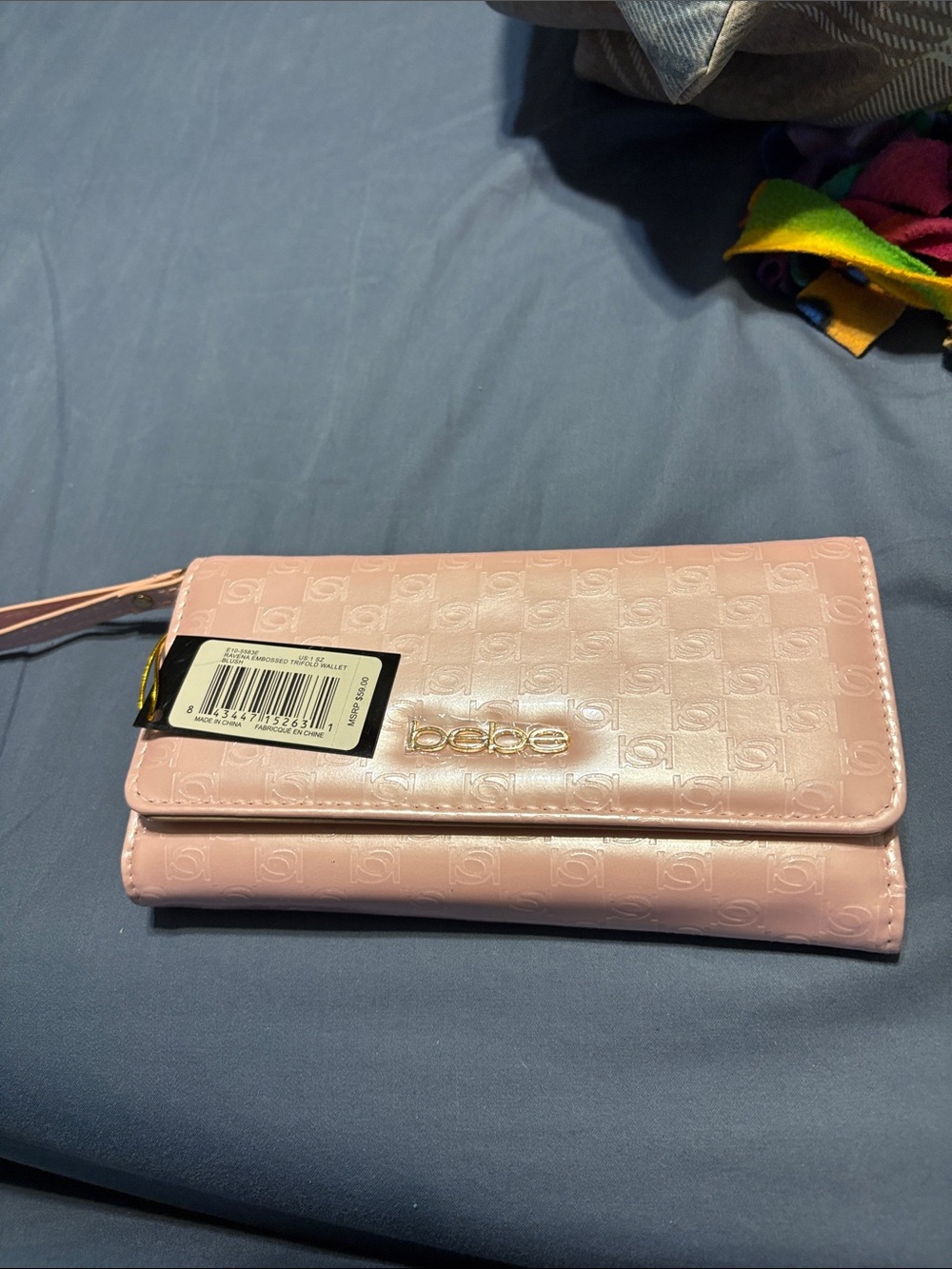 bebe Light Pink Embossed Wristlet Wallet with Gold Hardware